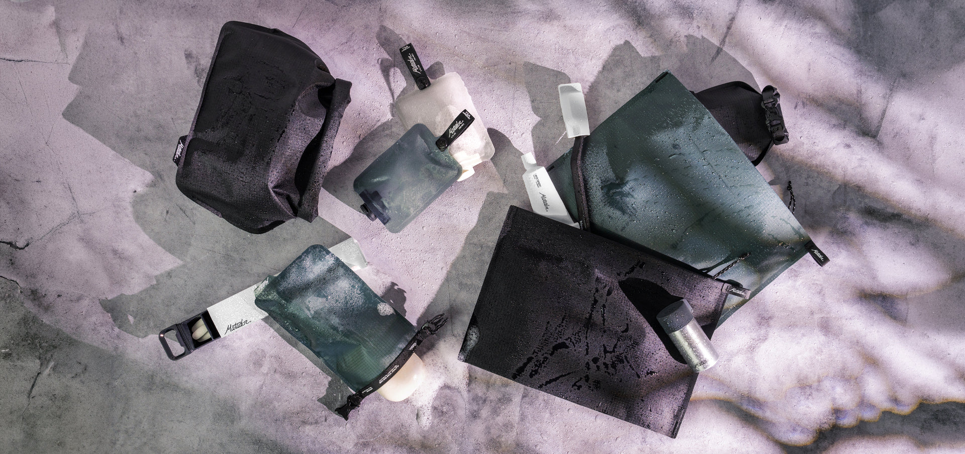 Pile of flatpak toiletry products on marbled background