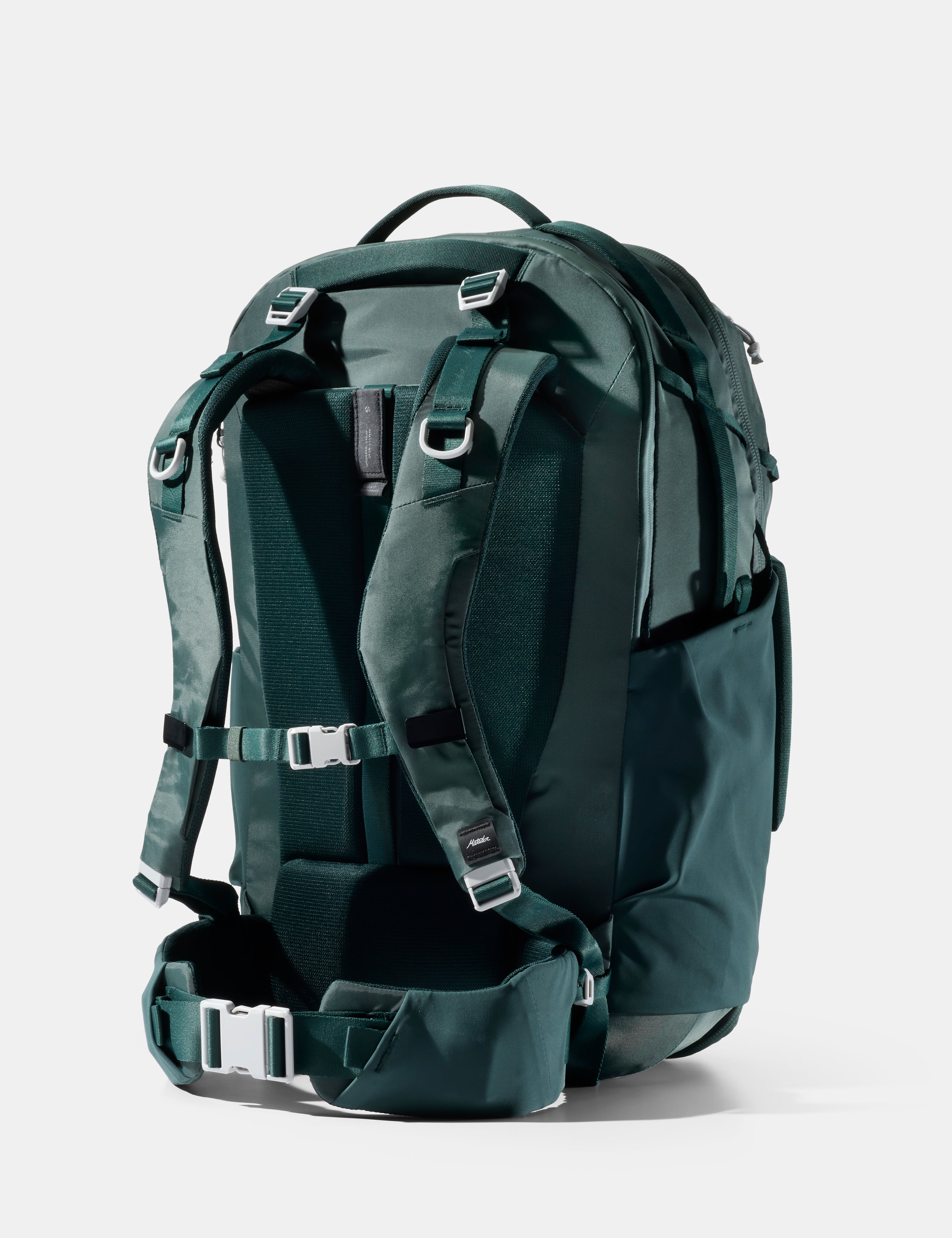 Green backpack on a white background