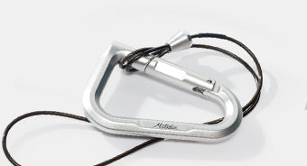 betalock carabiner with accessory cable on light gray background