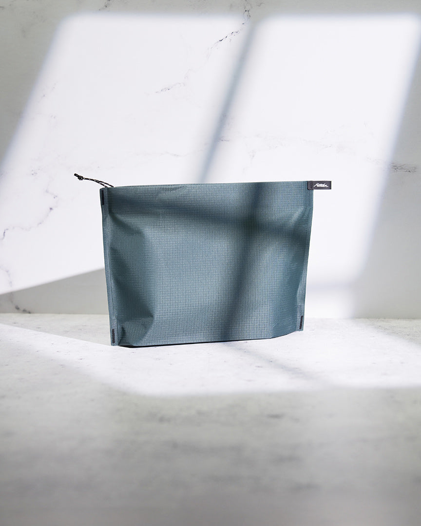 toiletry bag on a marble counter