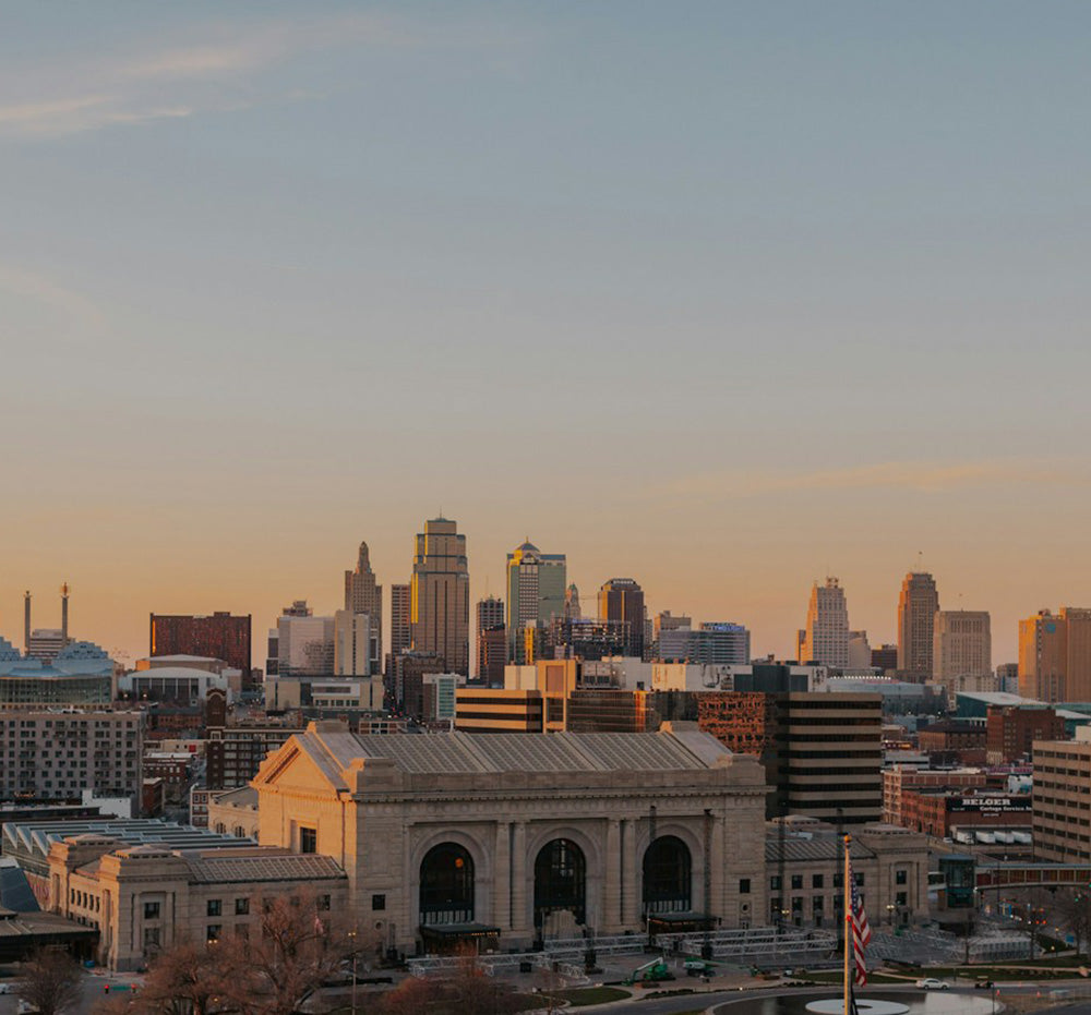 City skyline with a prominent building at sunset